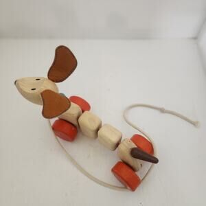 Plan Toys Wooden pull along dog.